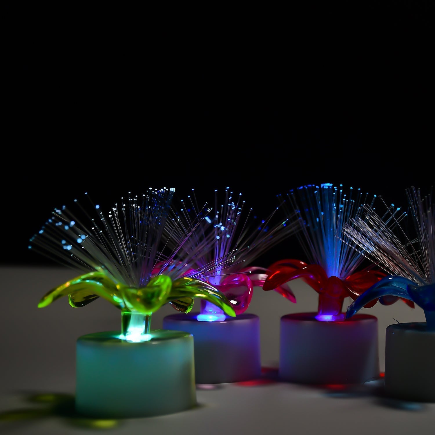 Mini color-changing LED table centerpiece, fiber optic light. Mini color-changing LED table centerpiece, fiber optic light.